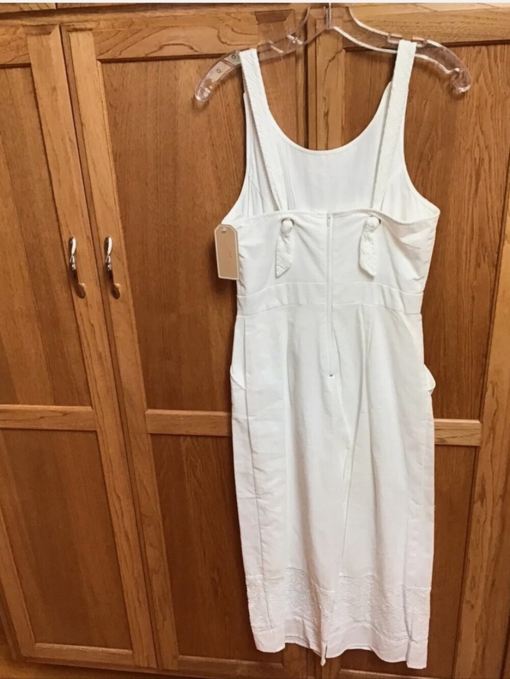 Copper Key white jumpsuit features distinct lace hem detailing